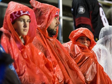 Fans in the rain during the first half.