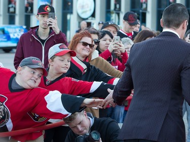 Fans strain to get a touch of Dion Phaneuf's hand as the Ottawa Senators get set to take on the Toronto Maple Leafs in NHL action at the Canadian Tire Centre. Wayne Cuddington/ Postmedia