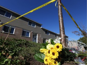 Flowers had been left at the scene of a Rosenthal Avenue homicide on Friday, Oct. 7, 2016.