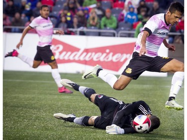 Fort Lauderdale's Victor Pineda is stopped by Ottawa Fury goalkeeper Romuald Peiser.