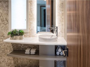 A warm palette, intriguing textures and natural finishes make for a welcoming space that pops in this powder room by Astro Design Centre, one of the finalists in the 2016 Housing Design Awards.