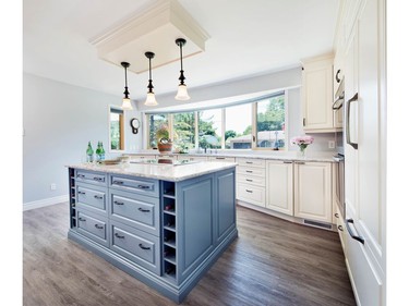 Laurysen Kitchens won the 2016 Housing Design Awards in the category of custom kitchen, 181 to 240 sq. ft., traditional, for a project that uses the bay window space to create a subtle curve in the cabinetry and countertop.