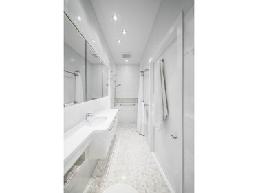 Design First Interiors won the 2016 Housing Design Awards in the category of custom bathroom, 100 sq. ft. or less, contemporary, for a room that needed more space without moving the walls.
