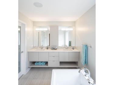 Deslaurier Custom Cabinets, RND Construction, and Christopher Simmonds Architect won the 2016 Housing Design Awards in the category of production bathroom for Riverpark Green.