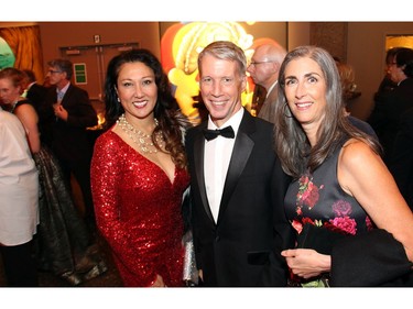 From left, Jamilah Murray from Sakto Corporation with Chief Government Whip Andrew Leslie, Liberal MP for OrlÈans, and Pam Murray at the National Arts Centre on Saturday, October 22, 2016, for the 20th annual NAC Gala for the  National Youth and Education Trust in support of the NACís arts education programs across Canada.