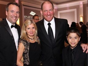 From left, Ottawa TV and radio personality Jeff Hopper, wife Louise White, and colleague "Stuntman" Stu Schwartz with his 10-year-old son, Matteo, cleaned up nicely for the black-tie grand opening gala celebration of the new Infinity Convention Centre, held Thursday, October 13, 2016.