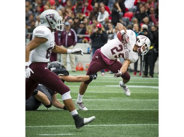 The Gee-Gees' Bryce Vieira fights to keep his balance during the 48th Panda Game.