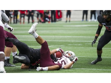 The Gee-Gees' Bryce Vieira is brought down.