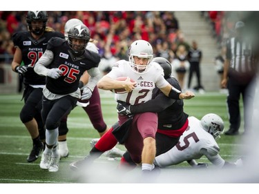 The Gee-Gees' Derek Wendel tries to get away.