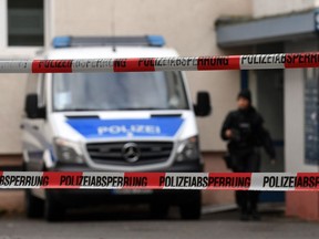 The police secures a residential area in Chemnitz, eastern Germany, on October 09, 2016, a day after the police found explosive material in the east German apartment of a Syrian man suspected of planning a bomb attack.  Police found several hundred grams of "explosive materials" in the east German apartment of a Syrian man suspected of planning a bomb attack, and arrested three people connected to him. The suspect who remains at large, 22-year-old Syrian Jaber Albakr, could have had "an Islamist motive" sources close to the police told AFP.