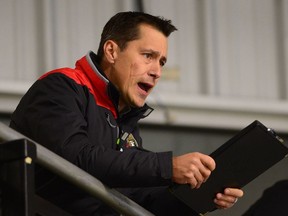Ottawa Senators head coach Guy Boucher watches his team during day two of training camp in Ottawa on Friday, Sept. 23, 2016.