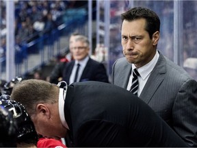 Ottawa Senators head coach Guy Boucher looks on as his team takes on the Toronto Maple Leafs during the first period of an NHL pre-season hockey game in Saskatoon, Tuesday, October 4, 2016.