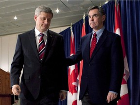 Then-Minister of the Environment Jim Prentice, right, and then-Prime Minister Stephen Harper walk away from the podium after Harper spoke to reporters following the 2009 United Nations Climate Change conference in Copenhagen, Denmark.