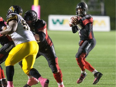 Henry Burris looks to make a pass during the first half.