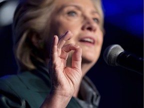 In this Oct. 5, 2016 photo, Democratic presidential candidate Hillary Clinton speaks at a Women for Hillary fundraiser at the Hyatt Regency in Washington.  Clinton took nearly every precaution to ensure voters would never know what she told investment bankers, lobbyists and corporate executives in dozens of closed-door paid speeches before running for president.  Turns out, the Democratic presidential nominee had good reason to do so.