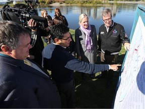 Ottawa Mayor Jim Watson and Environment Minister Catherine McKenna attended a infrastructure event regarding the overspill of sewage in the Ottawa River in Ottawa on Oct. 11, 2016.