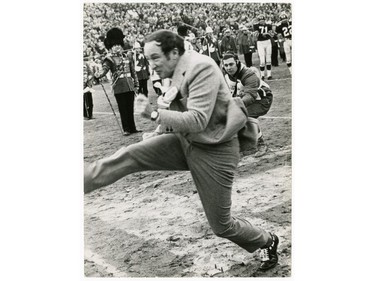 John Maiola's photo of Prime Minister Pierre Elliott Trudeau as he donned cleats for a kickoff that travelled less than 10 yards, 1968. Pat of the exhibit Cutlines, on at the National Gallery of Canada until February.