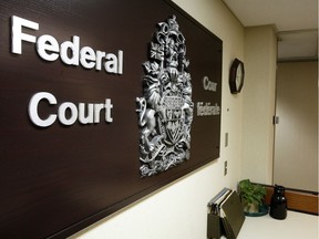 A federal scientist who accused his bosses at Natural Resources Canada of harassment and other "inappropriate behaviour" has won a court challenge of the department's decision to deny him a promotion.