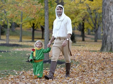 Prime Minister Justin Trudeau, dressed as the Pilot from The Little Prince, right, and his son Hadrien, dressed as the Little Prince, arrive at Rideau Hall to go trick-or-treating, on Halloween, Monday, Oct. 31, 2016 in Ottawa.