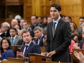 Prime Minister Justin Trudeau delivers a speech at the start of the Paris Agreement debate in the House of Commons on Parliament Hill in Ottawa on Monday, Oct. 3, 2016. Trudeau says the federal Liberal government will establish a "floor price'' on carbon pollution of $10 a tonne in 2018, rising to $50 a tonne by 2022.