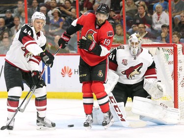 Kevin Connauton, left, tries to defend Derick Brassard in front of Mike Smith early in the first period.