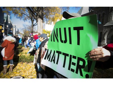 Labrador hunger strikers came to Ottawa to be part of a peaceful vigil organized to support land defenders at Muskrat Falls. Around 200 people gathered, locking arms and circling around the Human Rights Monument during the vigil.