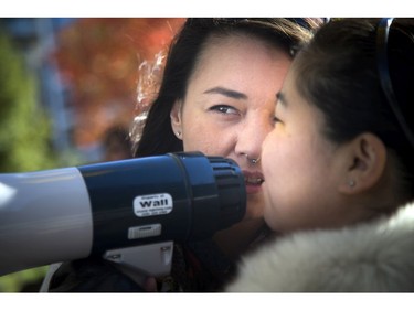 From left, throat singers Charlotte Qamaniq and Naomie Erkloo entertain the crowd at the vigil.