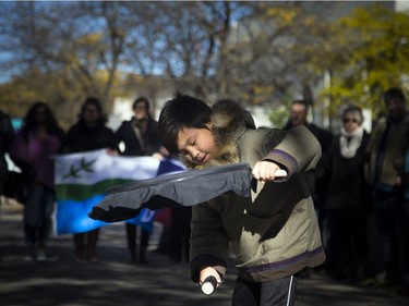 Labrador hunger strikers came to Ottawa on Sunday, Oct. 23, 2016, to be part of a peaceful vigil organized to support land defenders at Muskrat Falls, where they are trying to stop the flooding of an area that they believe will release methyl mercury into the water and soil. Around 200 people gathered on the steps of the Human Rights Monument on Elgin Street. Timothy Erkloo, 10, took part in the vigil during a drumming circle.