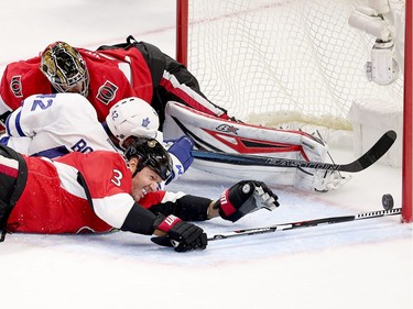 Marc Methot makes a diving save to prevent Tyler Bozak from scoring the go ahead goal in the third period as the Ottawa Senators get set to take on the Toronto Maple Leafs in NHL action at the Canadian Tire Centre. Wayne Cuddington/ Postmedia