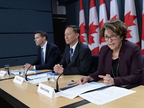 Senior government officials Marie Lemay, right to left, Alfred Tsang and Ryan Pilgrim hold a technical briefing at the National Press Theatre in Ottawa on Wednesday, Oct. 5, 2016.