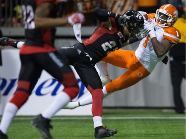 B.C. Lions' Terrell Sinkfield Jr., right, makes a reception in the end zone for a touchdown as Ottawa Redblacks' Mitchell White defends during the second half of a CFL football game in Vancouver, B.C., on Saturday October 1, 2016.