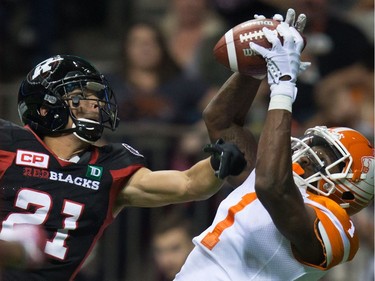B.C. Lions' Terrell Sinkfield Jr., right, makes a reception in the end zone for a touchdown as Ottawa Redblacks' Mitchell White defends during the second half of a CFL football game in Vancouver, B.C., on Saturday October 1, 2016.
