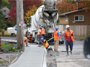 As construction continues on a new sidewalk running the length of Iris Street between Woodroffe Avenue and Greenbank Road, Kelly Egan asks: 'Why, why now, and is there $2.33 million in public benefit?'