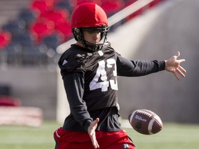 Newly signed Ottawa RedBlacks kicker Ray Early kicks a punt during team practice at TD Place on Monday October 17, 2016.