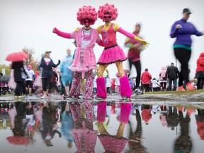 Nick Paquin, left, and Tristan Leblanc ham it up for a photo prior to the start of the Canadian Breast Cancer Foundation CIBC Run for the Cure in Ottawa on Sunday, Oct. 2, 2016.