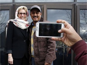 Ontario Premier Kathleen Wynne chats with a member of the Ottawa Main Mosque during a visit in November, 2015. (Darren Brown/Ottawa Citizen)