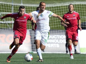 Ottawa Fury FC player Carl Haworth (17) and New York Cosmos player Adam Moffat (16) fights for the ball during the NASL match between Fury FC and Cosmos held at TD Place on Sunday, Oct. 9, 2016.