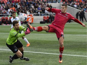 Ottawa Fury FC player Carl Haworth (17) takes a shot as New York Cosmos goalkeeper Jimmy Maurer (1) tries to stop the ball during the NASL match between Fury FC and Cosmos held at TD Place on Sunday, Oct. 9, 2016.