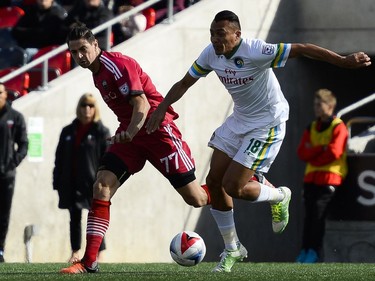 Ottawa Fury FC player Fernando Timbo (77) and New York Cosmos player Juan Arango (18) fights for the ball during the NASL match between Fury FC and Cosmos held at TD Place on Sunday, Oct. 9, 2016. (James Park)