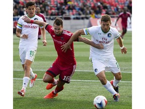 Ottawa Fury FC player Thomas Stewart (16) and New York Cosmos player Ryan Richter (2) fight for possession during the NASL match between Fury FC and Cosmos held at TD Place on Sunday, Oct. 9, 2016. (James Park)