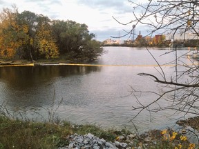 A floating boom contains raw sewage dumped into the Lièvre River while a treatment centre was under repairs.