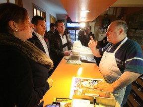 Lorenzo's Pizza owner, Elie Kirkish, talks to MPP Lisa MacLeod, Ontario PC leader Patrick Brown and Ottawa-Vanier PC candidate André Marin in Ottawa on Monday.