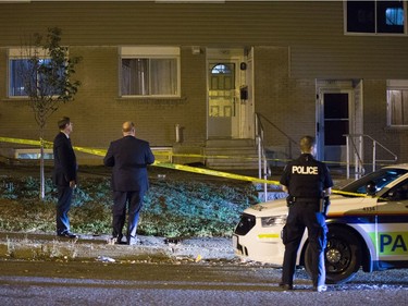 Police survey the scene of an apparent homicide outside of 1411 Rosenthal Ave off of Merivale Rd in the Carlington neighbourhood.