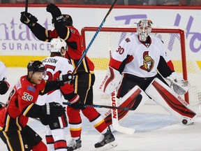 Ottawa Senators Andrew Hammond reacts after giving up a goal to Dougie Hamilton of the Calgary Flames during NHL hockey in Calgary on Friday, Oct. 28, 2016.