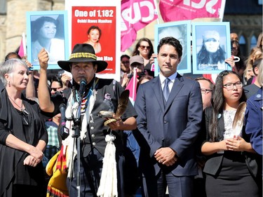 Prime Minister Justin Trudeau, along with a number of his female cabinet ministers, made a surprise visit to a vigil for missing and murdered Indigenous women, girls and Two-Spirit people (MMIWG2S) Tuesday (Oct. 4, 2016) on Parliament Hill.  Native leader Mista Wasis (front) addresses the crowd shortly after realizing the PM had snuck in behind him.