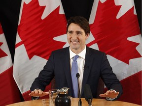 Prime Minister Justin Trudeau speaks with reporters during an interview with The Canadian Press in Ottawa on Wednesday, December 16, 2015.