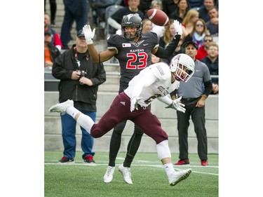 The Ravens' Nathaniel Hamlin throws his hands up as a pass goes incomplete to the Gee-Gees' Mitchell Baines.