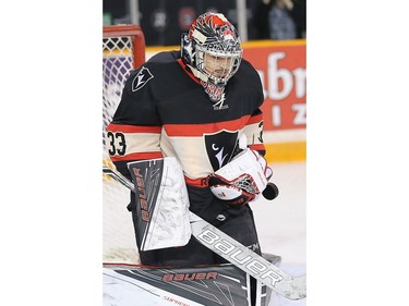 Ravens goalie Francois Brassard makes a stop in the second period.