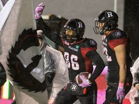 Redblacks receiver Juron Criner celebrates his first-half touchdown with Greg Ellingson, right, on Oct. 21, 2016.
