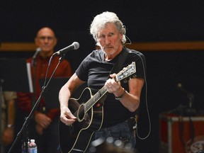 Roger Waters rehearses with members of the Wounded Warriors Project for the "Stand Up For Heroes" benefit concert presented by the New York Comedy Festival & the Bob Woodruff Foundation in New York in 2013.